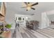 Cozy living room with fireplace, open floorplan, and views into the kitchen and dining area at 2871 Mullinix Rd, Greenwood, IN 46143