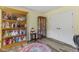 Office space with hardwood floors and built in cabinet with glass door at 2871 Mullinix Rd, Greenwood, IN 46143
