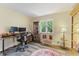 Office featuring a desk, cabinets, and a view to the front yard at 2871 Mullinix Rd, Greenwood, IN 46143