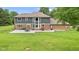 Two-story home featuring a combination of gray siding, brick accents, and expansive backyard views at 2871 Mullinix Rd, Greenwood, IN 46143