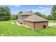 Beautiful two-story home with a brick and gray exterior and a large, well-maintained lawn at 2871 Mullinix Rd, Greenwood, IN 46143