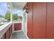 Cozy balcony with view, featuring a painted railing and an exterior light fixture at 2903 Winthrop Ave, Indianapolis, IN 46205