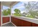 Balcony view with painted railing, overlooking nearby houses and verdant trees at 2903 Winthrop Ave, Indianapolis, IN 46205