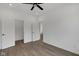 Neutral bedroom with wood-look floors, ceiling fan, and nearby closet at 2903 Winthrop Ave, Indianapolis, IN 46205