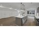 Spacious, well-lit kitchen featuring an island, stainless steel appliances, and open design at 2903 Winthrop Ave, Indianapolis, IN 46205
