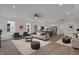 Spacious open-concept living room and kitchen features stylish furnishings and stainless steel appliances at 2903 Winthrop Ave, Indianapolis, IN 46205
