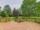 Outdoor space with a wooden deck and fenced yard at 3004 N Timber Ln, Muncie, IN 47304