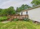 Wooden deck surrounded by green grass and landscaping at 3004 N Timber Ln, Muncie, IN 47304