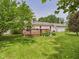 Backyard with a deck and green space at 3004 N Timber Ln, Muncie, IN 47304