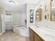 Bright bathroom featuring double sinks, a tub, and decorative accents at 3004 N Timber Ln, Muncie, IN 47304