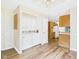 View of the laundry room featuring a washer, dryer, shelving, and access to the kitchen at 3004 N Timber Ln, Muncie, IN 47304