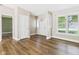 Inviting living room featuring newer flooring, neutral paint, and natural light at 3004 N Timber Ln, Muncie, IN 47304