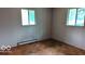 Cozy bedroom with hardwood floors and natural light from a window at 317 Grovewood Dr, Beech Grove, IN 46107
