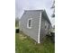View of home's durable gray siding and functional rain guttering near the green lawn at 3202 N Emerson Ave, Indianapolis, IN 46218