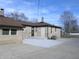 A wide concrete patio can be seen at the rear of this ranch-style house at 3456 S Sadlier S Dr, Indianapolis, IN 46239