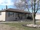 This ranch-style house has an expansive front lawn and mature trees at 3456 S Sadlier S Dr, Indianapolis, IN 46239