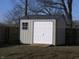 This outbuilding is painted gray with a gray metal roof. A ramp provides easy access at 3456 S Sadlier S Dr, Indianapolis, IN 46239