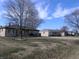 Street view of single-story brick homes with bare trees and blue skies at 3456 S Sadlier S Dr, Indianapolis, IN 46239