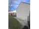 This ample side yard includes a small gravel walk at 3456 S Sadlier S Dr, Indianapolis, IN 46239