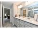 Bathroom featuring double vanity, quartz counters, tile floors, and a view into the primary bedroom at 3872 New Battle Ln, Bargersville, IN 46106
