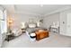 Spacious Primary bedroom with tray ceiling, sitting area, and a charming wooden chest accent piece at 3872 New Battle Ln, Bargersville, IN 46106