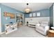 Bedroom space with storage, decor, and a crib with a comfortable recliner, perfect for relaxation at 3872 New Battle Ln, Bargersville, IN 46106