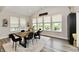Charming dining room with natural light, modern black chairs, and backyard view at 3872 New Battle Ln, Bargersville, IN 46106