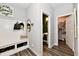 Entryway with built-in bench, storage, and access to a powder room and pantry at 3872 New Battle Ln, Bargersville, IN 46106