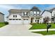 Charming two-story home with landscaped yard, three-car garage, and inviting curb appeal at 3872 New Battle Ln, Bargersville, IN 46106