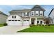 Beautiful two-story home with a manicured lawn, charming landscaping, and a three car garage at 3872 New Battle Ln, Bargersville, IN 46106