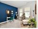 Comfortable office space with accent wall, chair, ottoman, and natural light at 3872 New Battle Ln, Bargersville, IN 46106