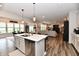 Spacious, open floor plan with kitchen island flowing into dining and living areas at 3872 New Battle Ln, Bargersville, IN 46106