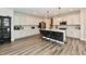 Modern kitchen with stainless steel appliances, a large island, and white cabinets at 3872 New Battle Ln, Bargersville, IN 46106