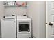 Laundry room with modern white washer and dryer appliances at 3872 New Battle Ln, Bargersville, IN 46106