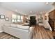Bright and spacious living room with a large sectional sofa and view of the fireplace at 3872 New Battle Ln, Bargersville, IN 46106