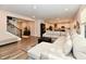 Bright and open living room features sectional sofa, hardwood floors and stairwell at 3872 New Battle Ln, Bargersville, IN 46106