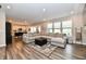 Spacious open-concept living room with a large sectional sofa and modern decor at 3872 New Battle Ln, Bargersville, IN 46106