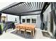 Covered patio with dining table and chairs under a pergola at 3872 New Battle Ln, Bargersville, IN 46106