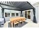 Covered patio with dining table and chairs under a pergola at 3872 New Battle Ln, Bargersville, IN 46106