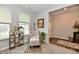 Cozy sitting room with comfortable armchair, natural light, and elegant decor at 3872 New Battle Ln, Bargersville, IN 46106