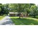 Aerial view of home with large yard, mature trees, and backyard deck at 4124 Five Points Rd, Indianapolis, IN 46239