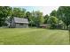 Large backyard showcasing a barn and shed, perfect for outdoor activities at 4124 Five Points Rd, Indianapolis, IN 46239