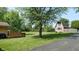 Expansive backyard featuring a wooden deck and a charming barn-style shed at 4124 Five Points Rd, Indianapolis, IN 46239