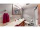 Bathroom featuring tiled backsplash, modern sink, and framed mirror at 4124 Five Points Rd, Indianapolis, IN 46239
