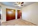 Carpeted bedroom with closet and ceiling fan at 4124 Five Points Rd, Indianapolis, IN 46239