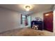 Bedroom with carpet, window, and door at 4124 Five Points Rd, Indianapolis, IN 46239