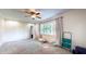 Cozy bedroom with natural light, carpet flooring, and a ceiling fan at 4124 Five Points Rd, Indianapolis, IN 46239