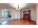 Elegant dining room with hardwood floors and a classic china cabinet at 4124 Five Points Rd, Indianapolis, IN 46239