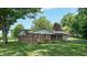 Charming single-story brick home with mature trees at 4124 Five Points Rd, Indianapolis, IN 46239