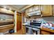 Cozy kitchen with ample cabinetry, updated appliances and plenty of counter space at 4124 Five Points Rd, Indianapolis, IN 46239